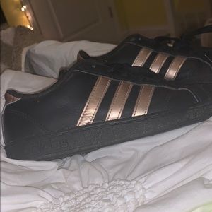 Black and gold adidas shoes